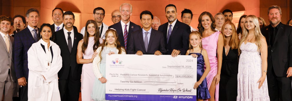helping kids fight cancer foundation showing their big check from hyundai hope on wheels - Bob Johnson Hyundai in Watertown NY